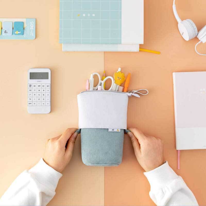 Stylish pop-up pencil case made from durable vegan leather and soft pastel corduroy.