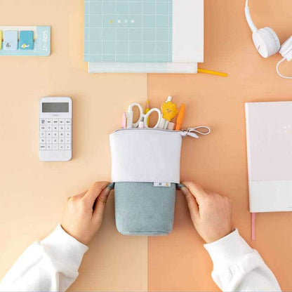 Stylish pop-up pencil case made from durable vegan leather and soft pastel corduroy.