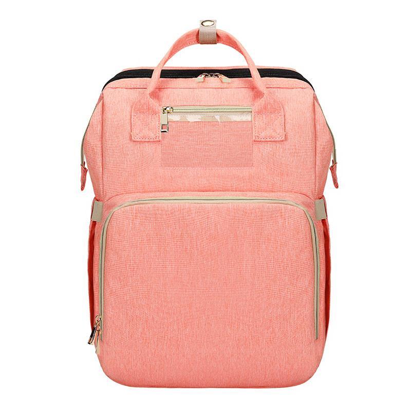 Essential baby gear: a portable crib and spacious diaper bag backpack for all newborn needs and travel.