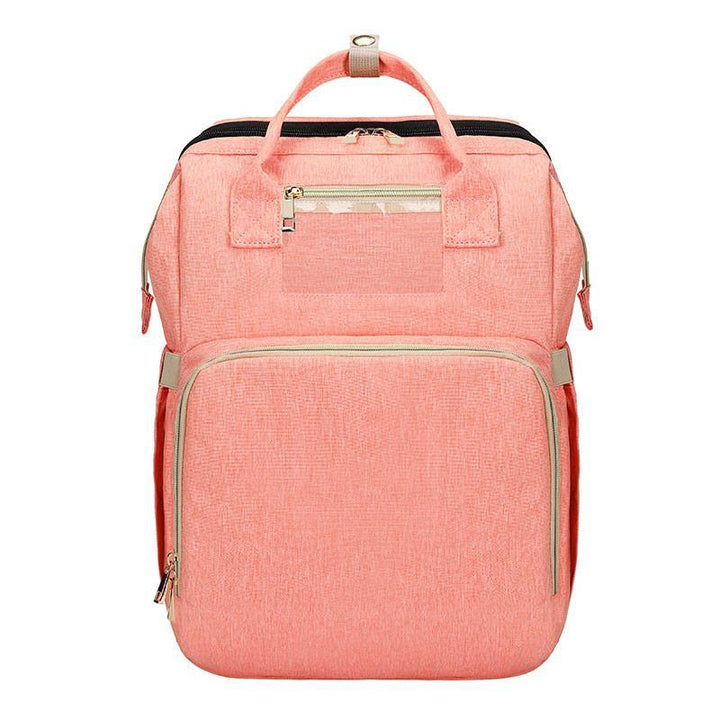 Essential baby gear: a portable crib and spacious diaper bag backpack for all newborn needs and travel.