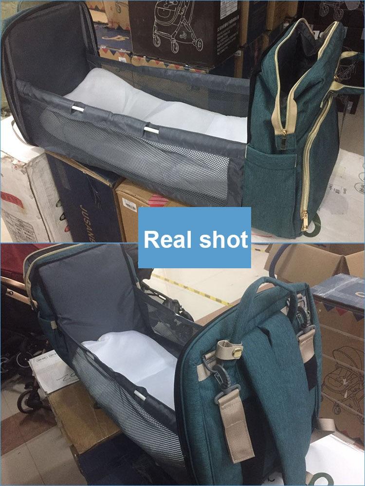Parenting solution: portable crib & spacious diaper bag backpack with insulated bottle pocket. Compact & safe.