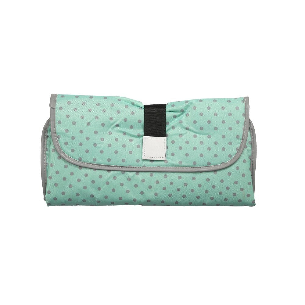 Portable changing pad with an attached toy loop, keeping baby entertained during diaper changes.