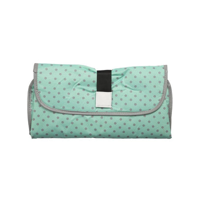 Portable changing pad with an attached toy loop, keeping baby entertained during diaper changes.