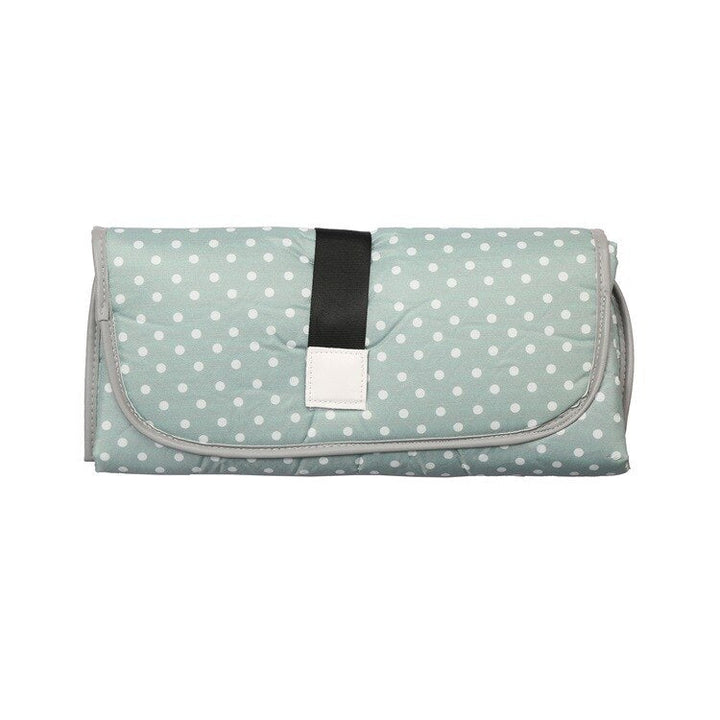 High-angle view of the portable changing pad, demonstrating its spacious and hygienic changing surface.