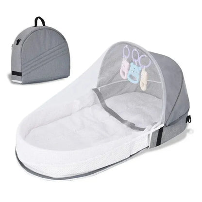 Portable newborn travel bassinet with mosquito net, demonstrating foldable feature