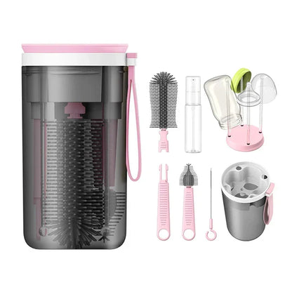Travel baby bottle cleaner kit, including bottle brush, nipple brush, and drying stand.