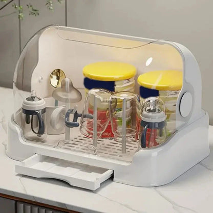 Top view of a portable baby bottle drying rack, showcasing its organized and dust-protected design.
