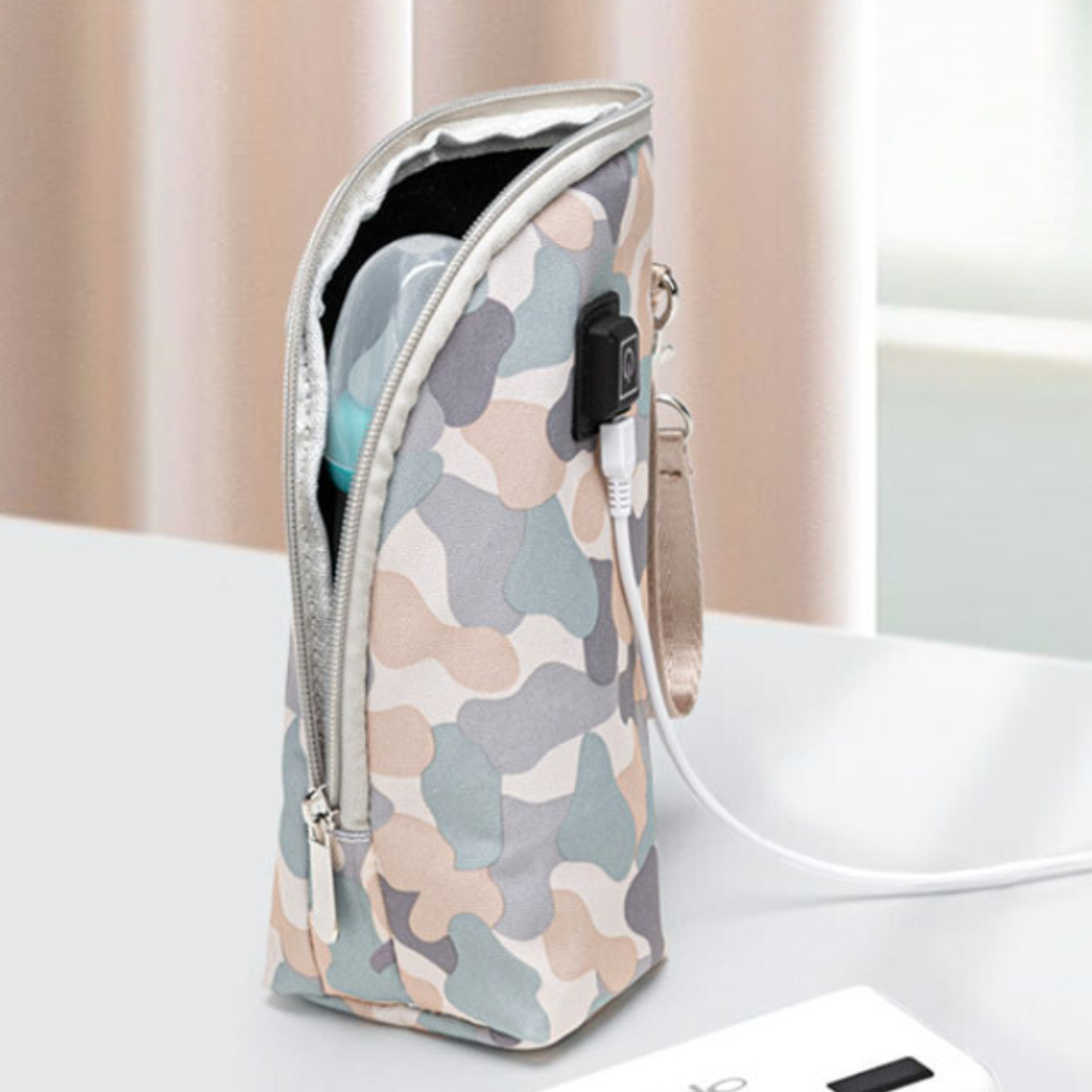 Compact travel baby bottle warmer, USB powered, for convenient newborn feeding solutions.