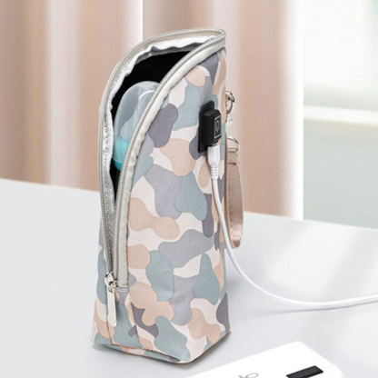 Compact travel baby bottle warmer, USB powered, for convenient newborn feeding solutions.