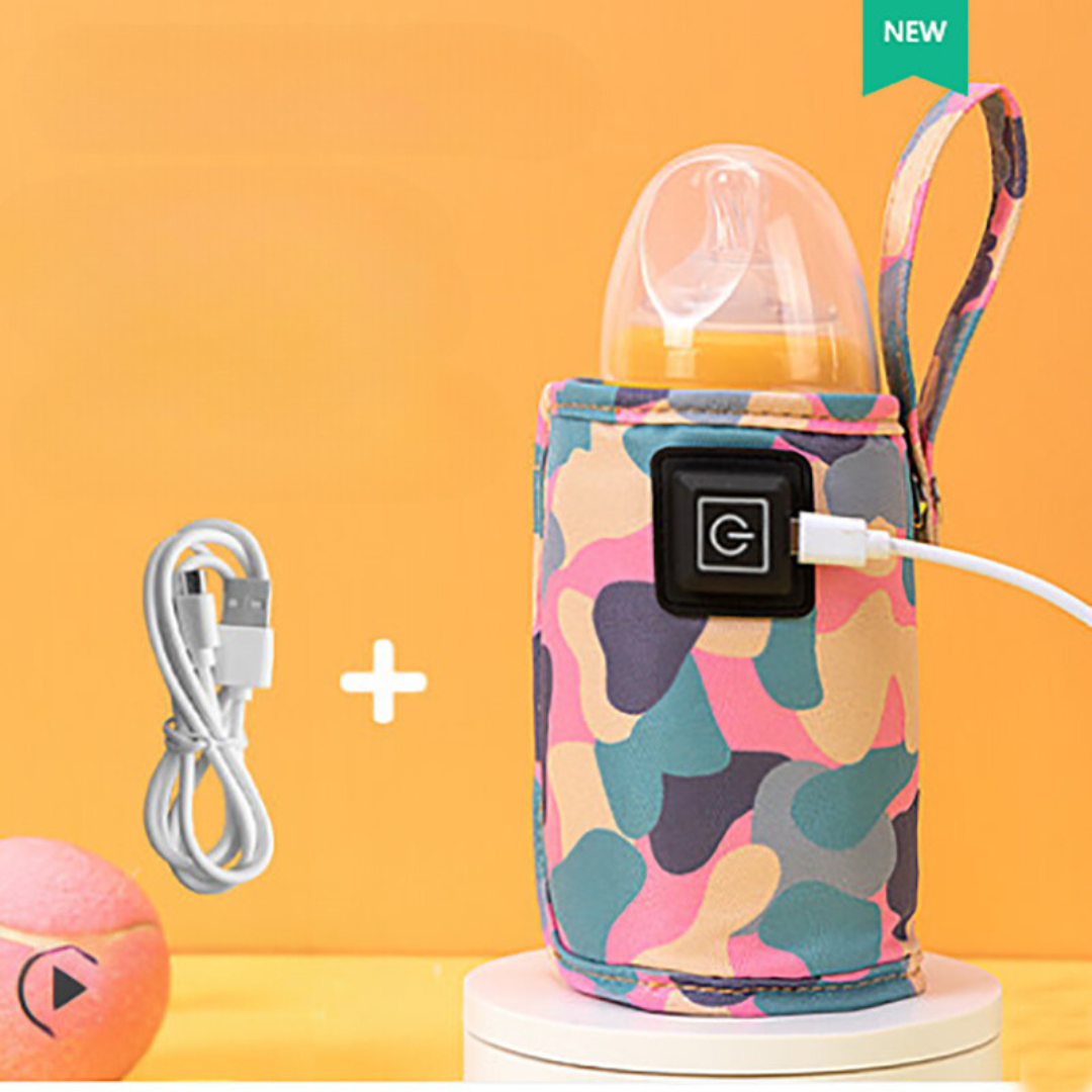 Hand holding a portable baby bottle warmer, ready for travel and newborn care.