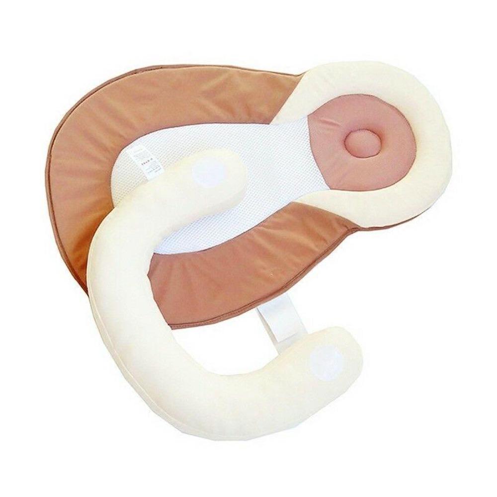 Compact portable baby bed designed for safe sleep, preventing rolls, ideal for travel