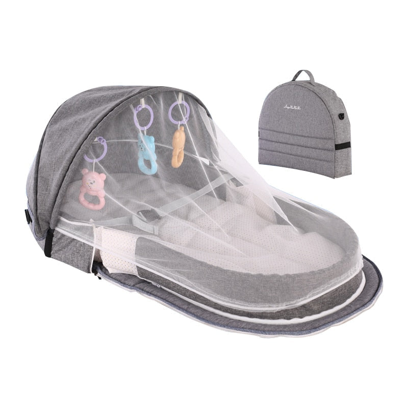 Secure infant travel crib with integrated mosquito net & UV sun protection canopy for outdoor use.