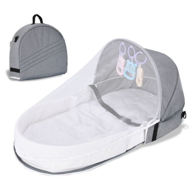 Newborn sleeper: portable infant travel crib with mosquito net & sun canopy for outdoor adventures.