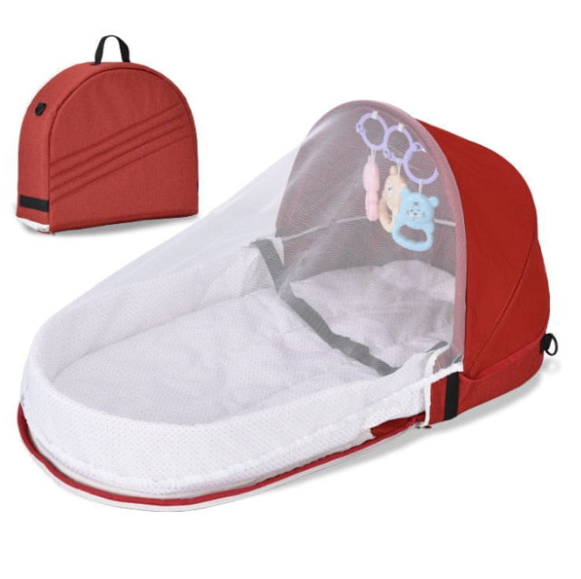 Compact portable baby travel crib with mosquito net & sun protection for ultimate infant safety.