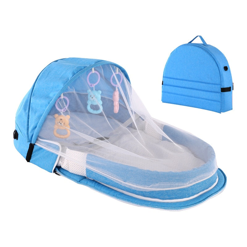 On-the-go infant bed: portable travel crib with mosquito net & sun canopy for ultimate protection.
