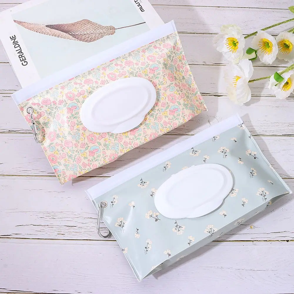 Blue portable baby wipe dispenser with snap strap, ideal for travel & diaper bags