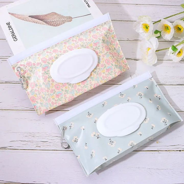 Blue portable baby wipe dispenser with snap strap, ideal for travel & diaper bags