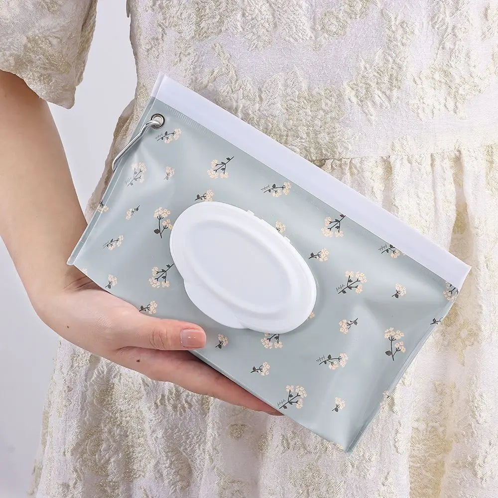 Compact baby wipe case with snap strap, perfect for on-the-go diaper changes