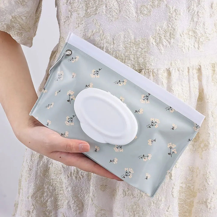Compact baby wipe case with snap strap, perfect for on-the-go diaper changes