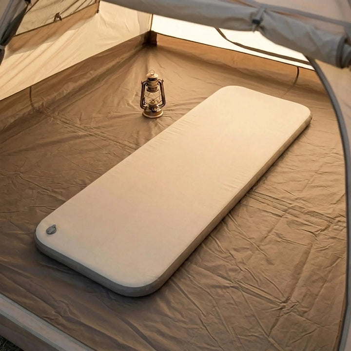 Portable camping air mattress for comfortable outdoor adventures & travel. Durable inflatable sleeping pad.