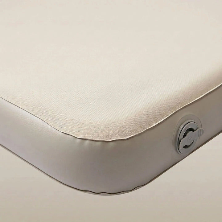 Quick-inflating portable air mattress for camping. Ideal for comfortable outdoor sleep, hiking, and adventure travel.