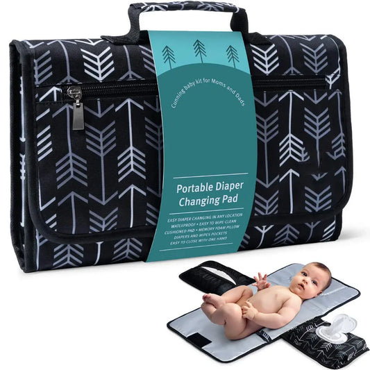 Portable changing pad with waterproof surface, ideal for diaper changes on the go for baby.