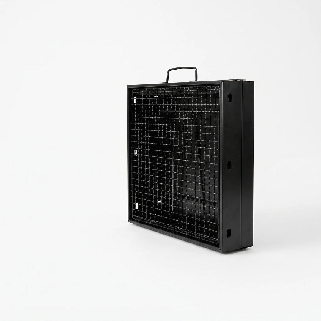 Compact folding charcoal grill for camping & picnics. Portable outdoor cooking, ideal for any adventure.