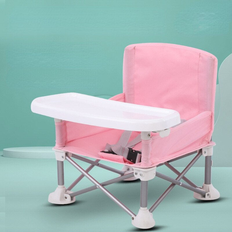 Portable children's camping dining chair with tray, perfect for outdoor meals and travel adventures.