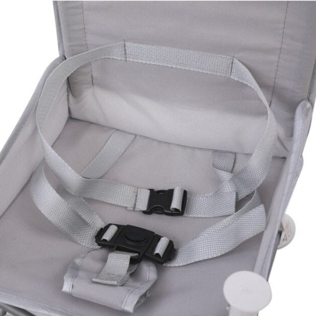 Child's travel camping chair with dining tray, ideal for an adventure-ready family.