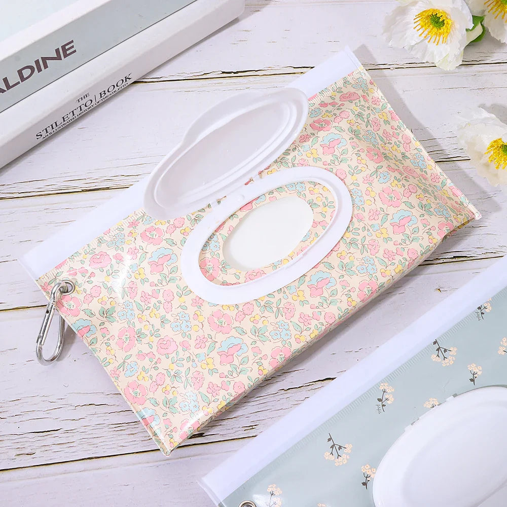 Patterned portable wet wipes pouch with snap cover, adds style to baby gear