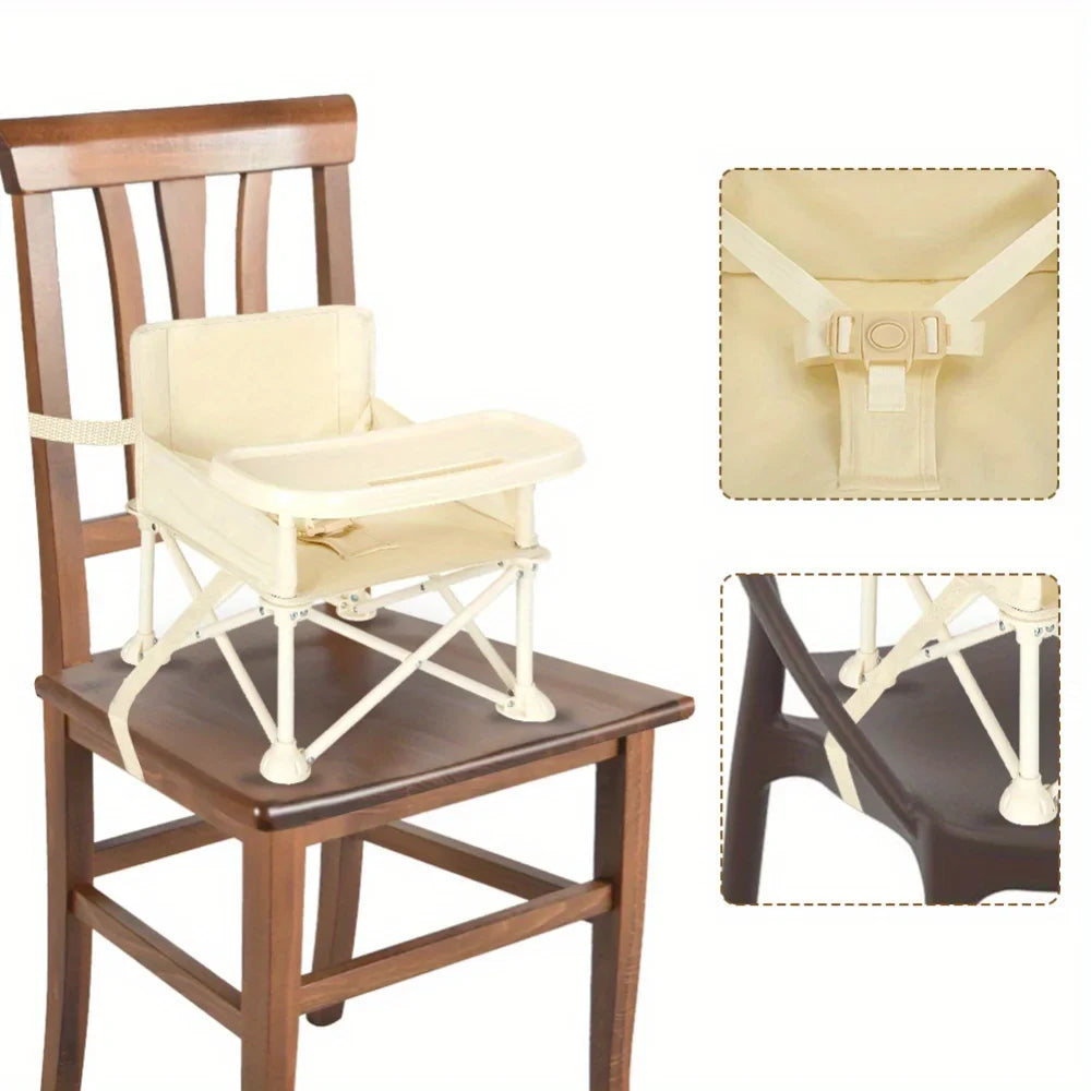 Foldable baby high chair in grey with secure harness, easy to transport for kids feeding.