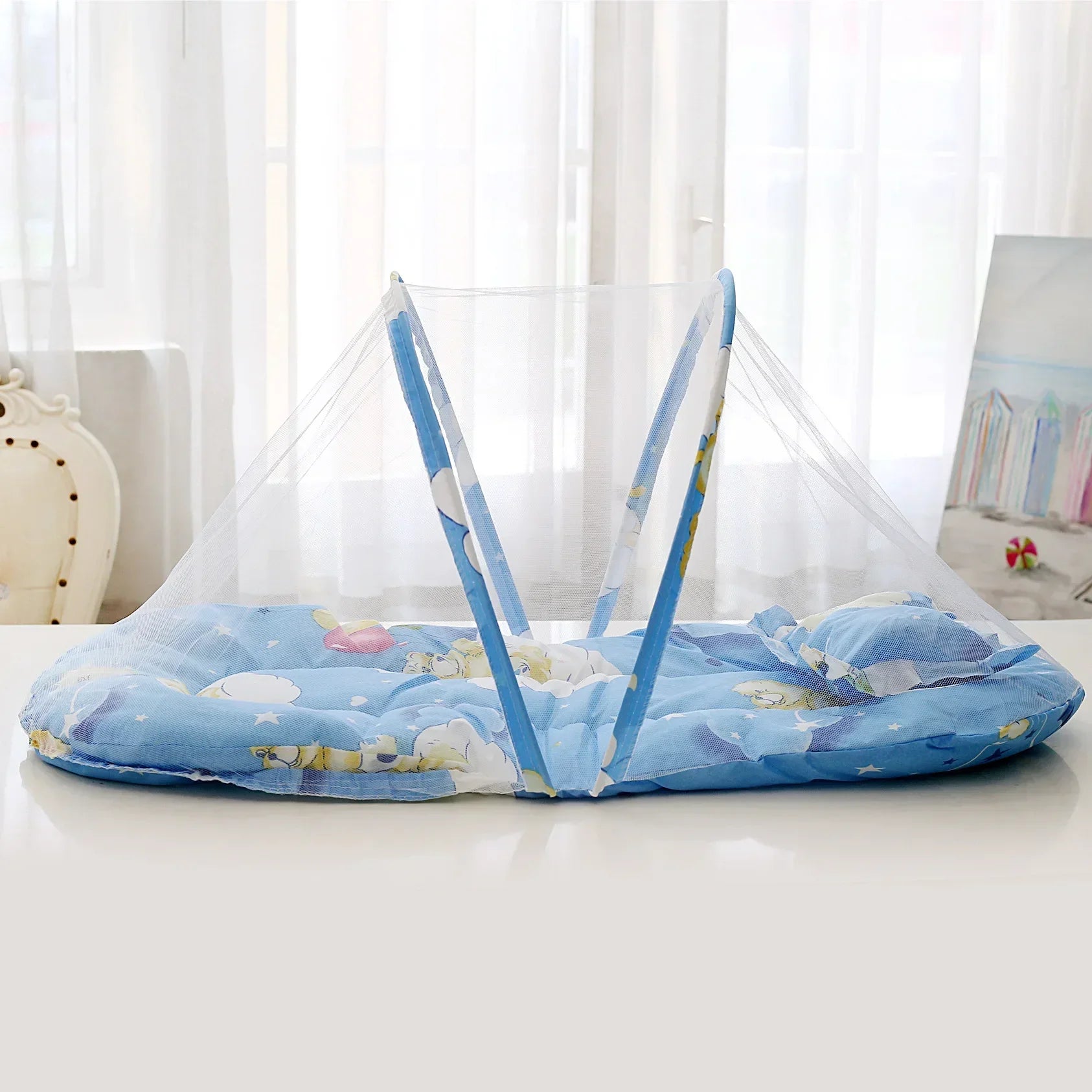 Foldable baby mosquito net, compact and portable, featuring fine mesh for crib insect protection.