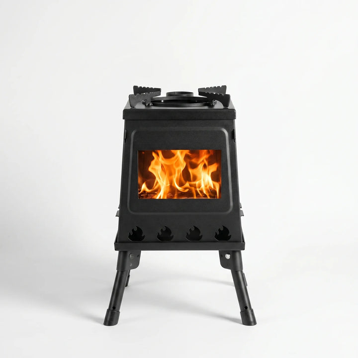 Durable folding camping stove in use, perfect for outdoor cooking, hiking & camp meals. Carbon steel design.