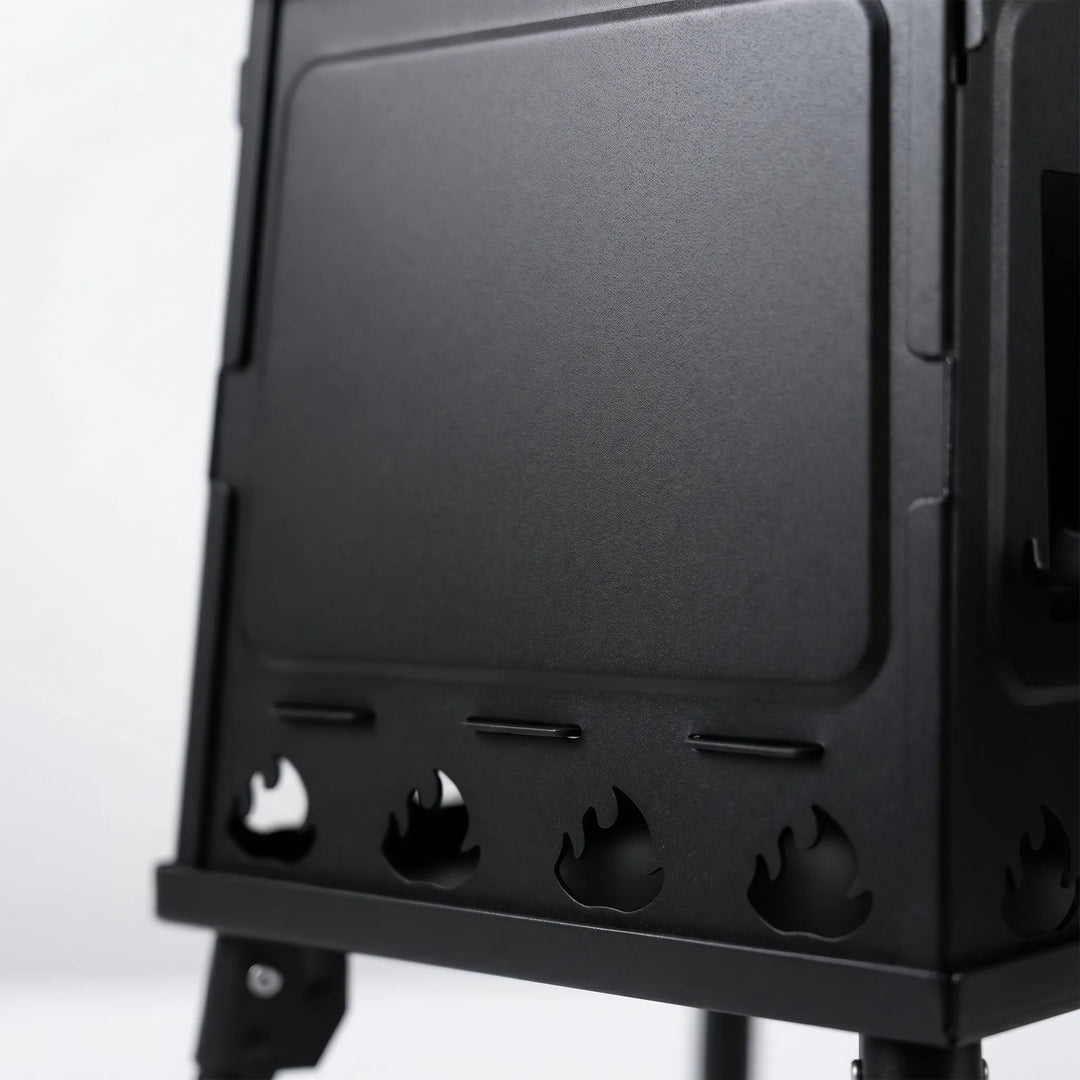 Compact folding carbon steel hiking stove, ideal portable cooking equipment for camping & outdoor adventures.
