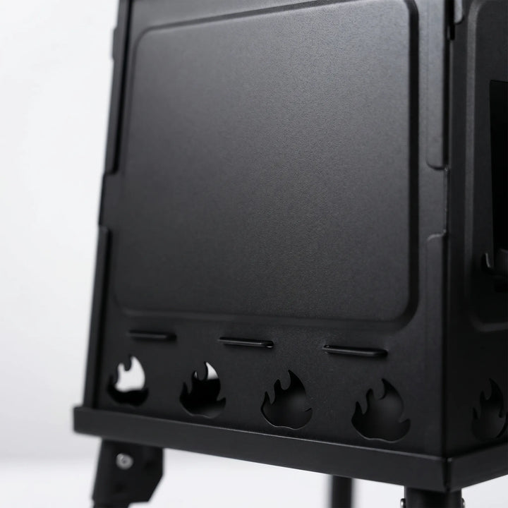 Compact folding carbon steel hiking stove, ideal portable cooking equipment for camping & outdoor adventures.