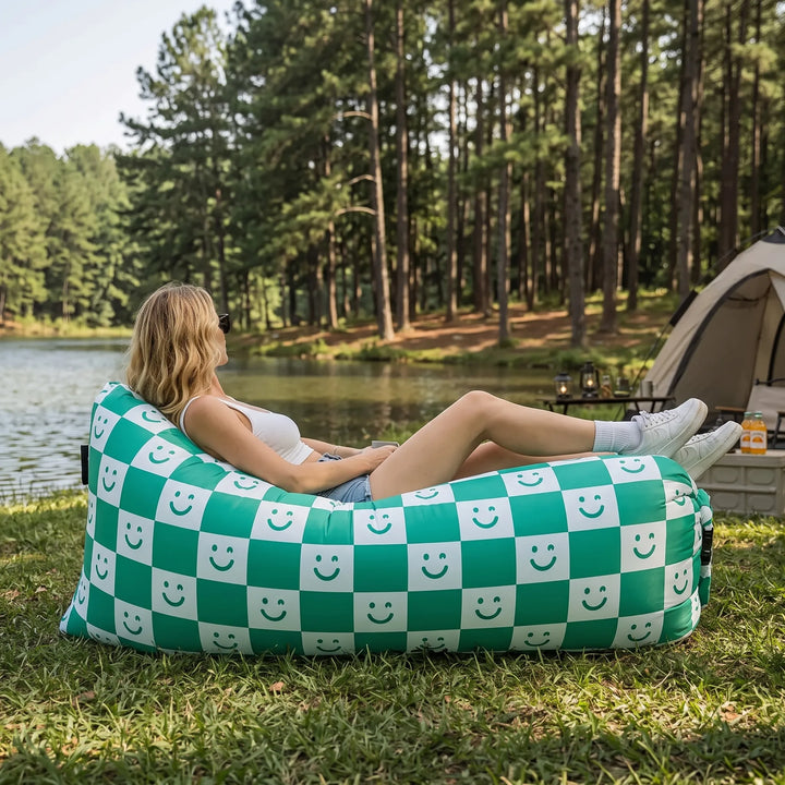 Portable inflatable air sofa lounger for outdoor relaxation. Easy-to-carry outdoor seating solution.