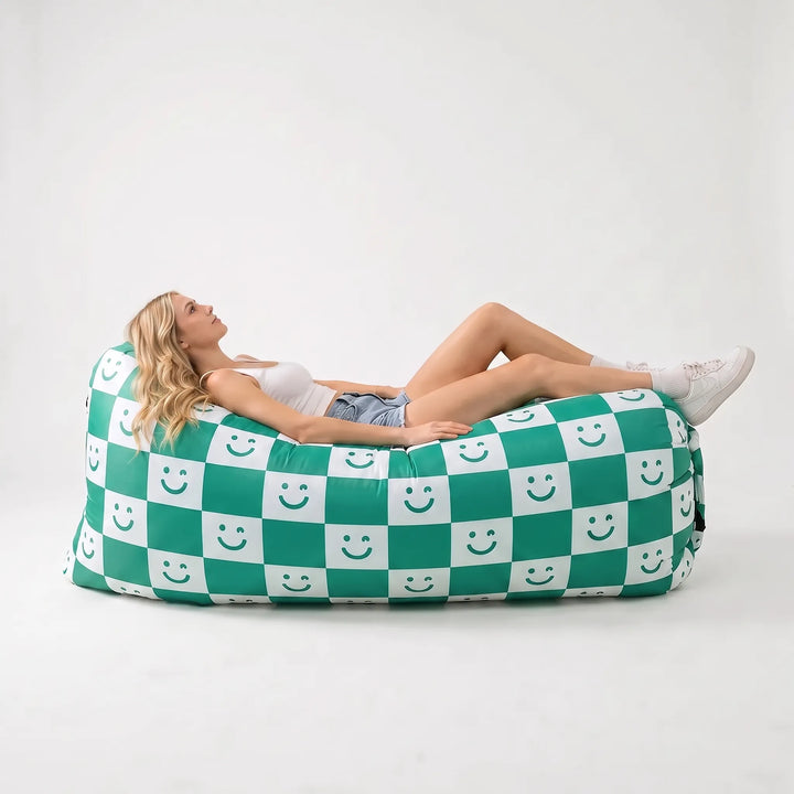 Relaxing inflatable air couch, perfect as a beach chair or portable lounger for seaside comfort.