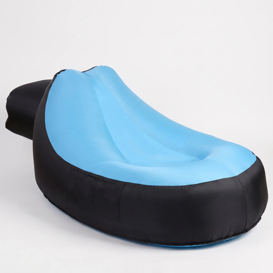 Lightweight, easy setup inflatable beach lounger; comfortable portable seating for sunbathing poolside.