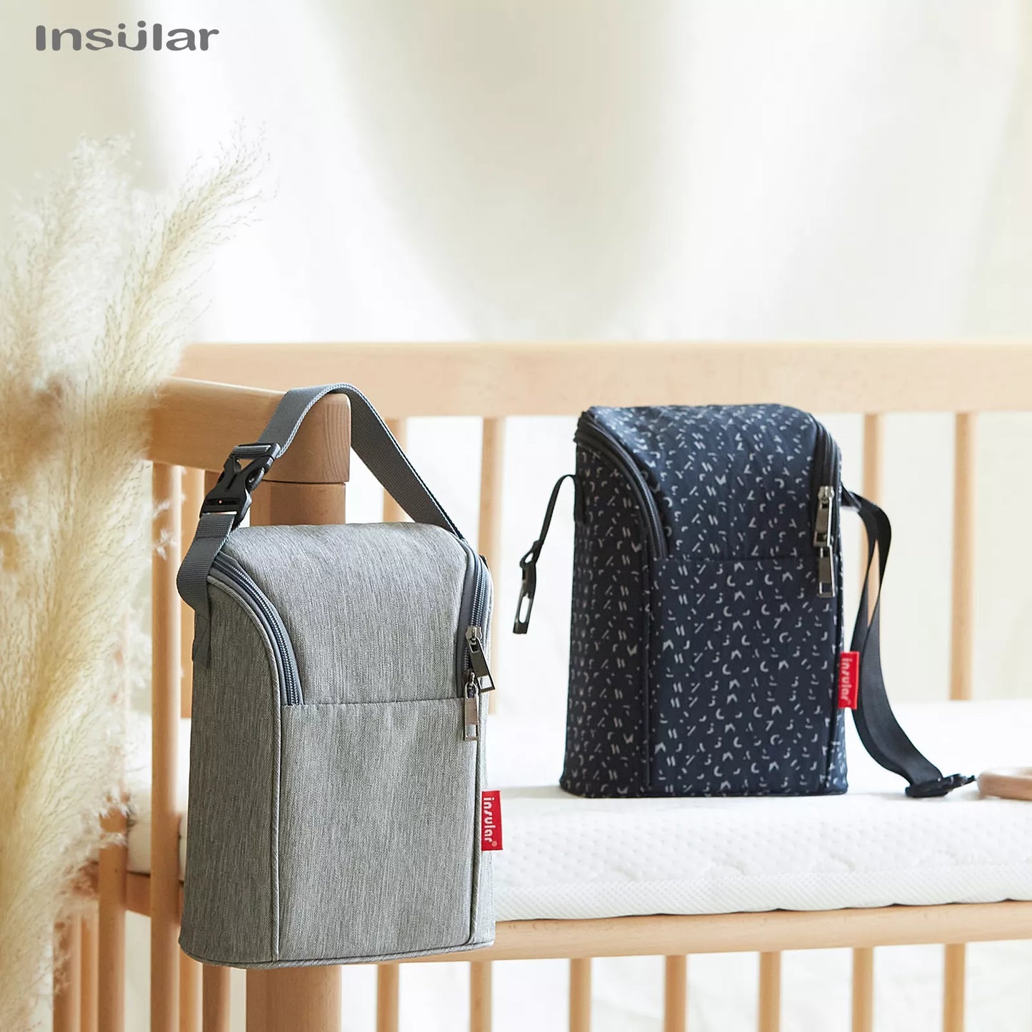 Compact breast milk cooler bag, gray, holds multiple bottles, perfect diaper bag accessory for new moms