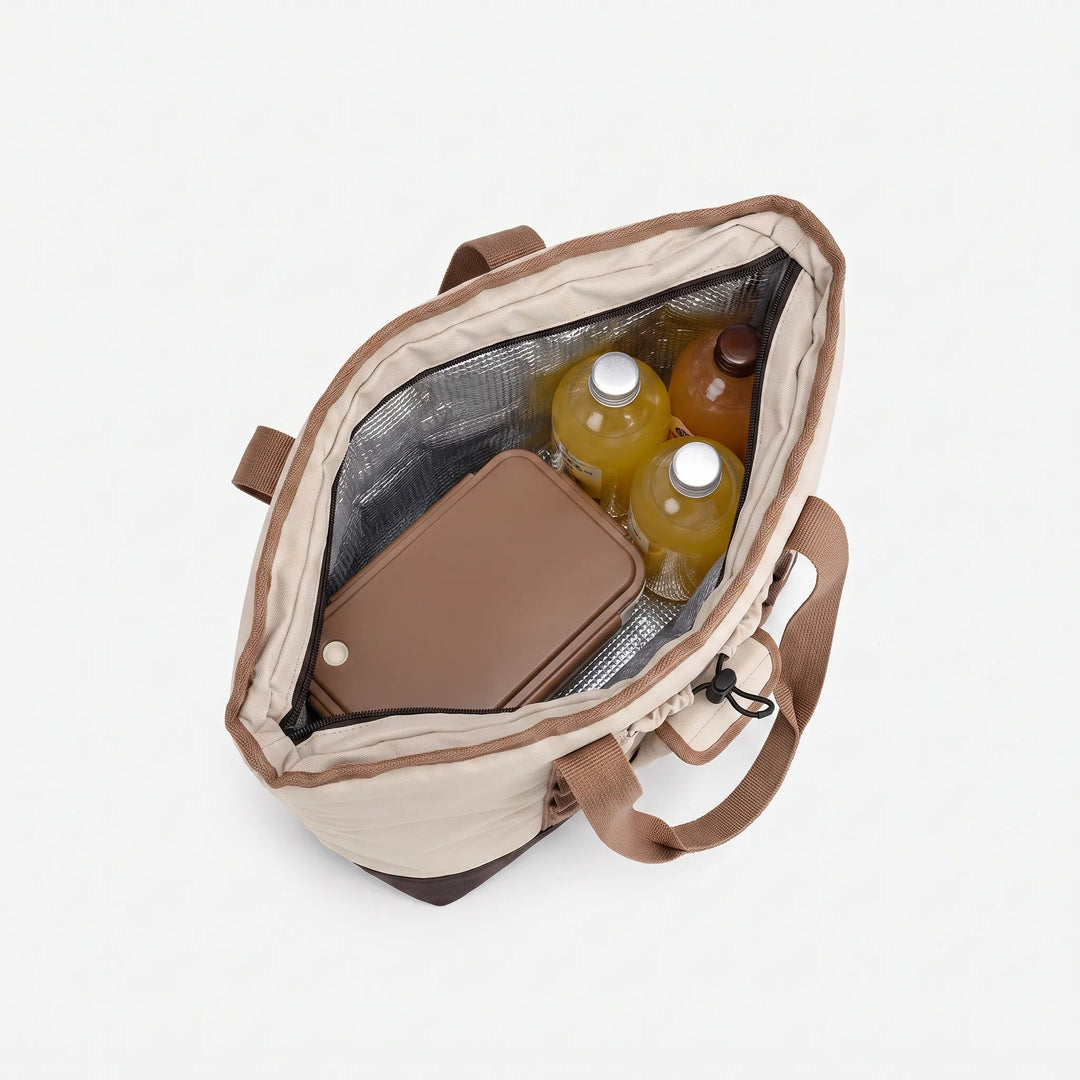 Compact portable cooler bag, perfect for outdoor picnics and lunch. Insulated to maintain food temperature for hours.