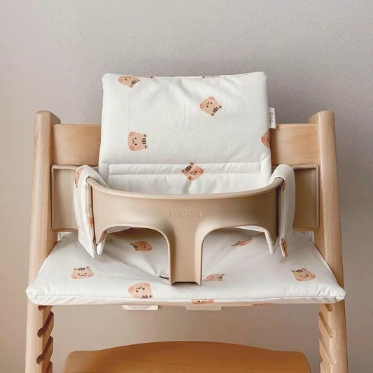 Portable non-slip baby chair cushion in a cute animal print, perfect for infant dining support.