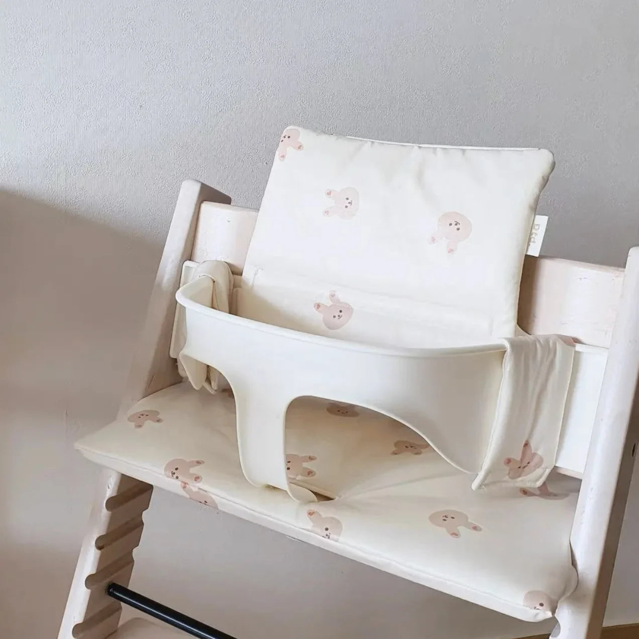 Stylish nursery decor addition: animal print baby chair cushion, also functions as an infant dining support.