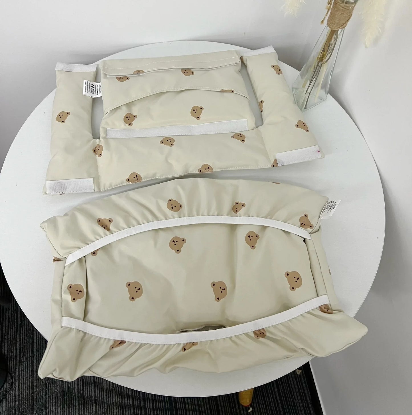 Compact baby feeding accessory: animal print high chair cushion, easily transportable for busy parents.
