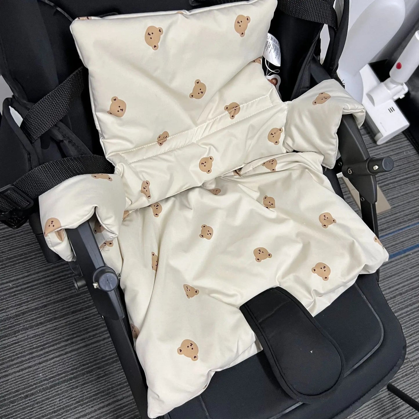 Secure portable high chair cushion with an engaging animal pattern, promoting enjoyable toddler mealtime.