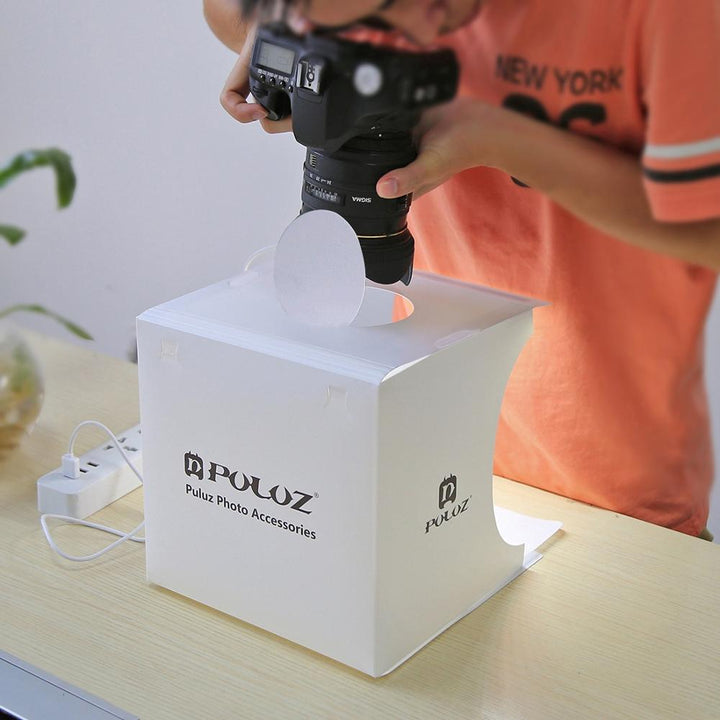 Easy-setup portable photo studio box with integrated LED lighting, perfect for high-quality small product shots.