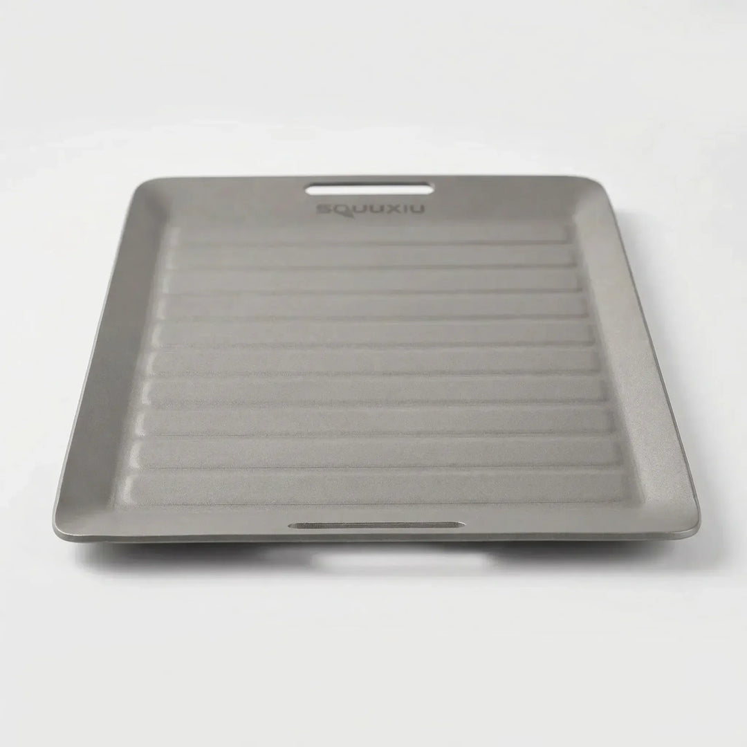 Lightweight ridged grill plate with BBQ tongs, perfect for solo camping, hiking, backpacking & outdoor cooking.