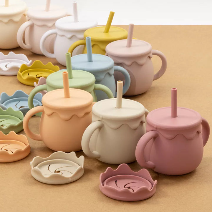 Secure-grip silicone baby food cup with handle, excellent for travel & active toddlers.
