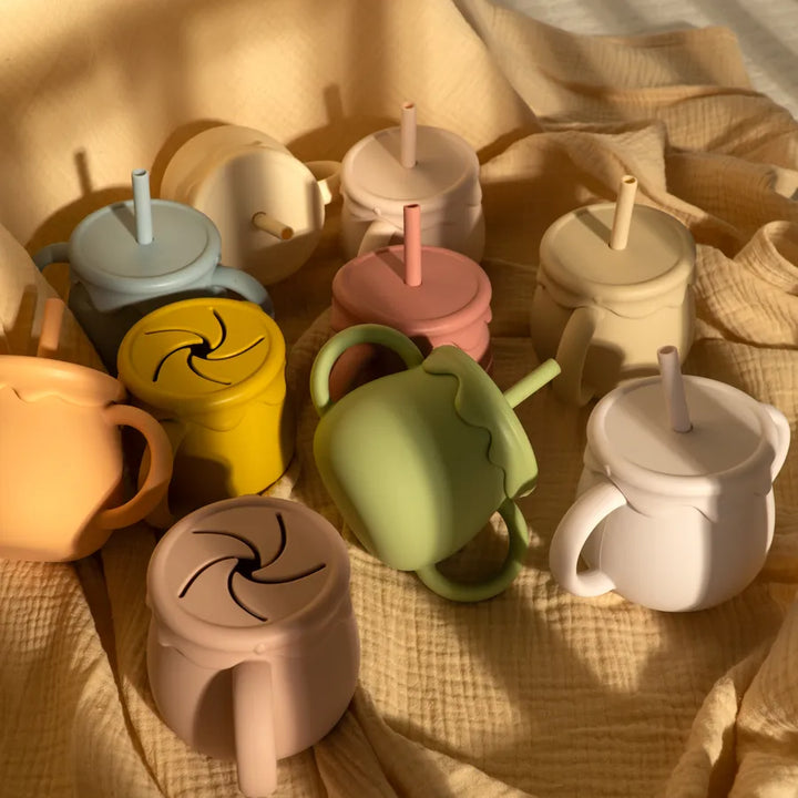 Modern silicone food cup with handle, making on-the-go baby feeding and toddler snacks simple.