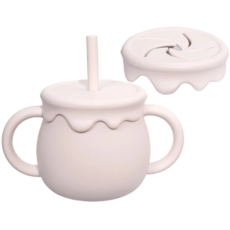 Compact and portable silicone food cup with handle for fuss-free baby meals & toddler snacks.