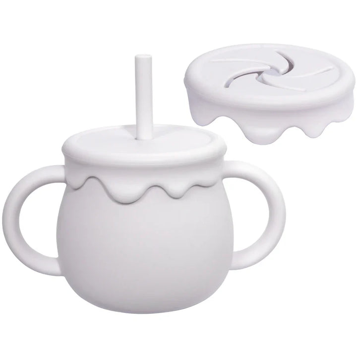 Baby-friendly silicone food cup with easy-grip handle, ideal for on-the-go infant feeding.